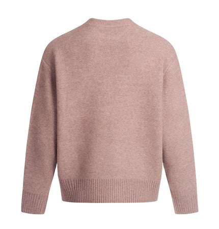 Back view of the Semi-High Neck Simple Knit Sweater in soft pink, showcasing its loose-fit design and ribbed hem.