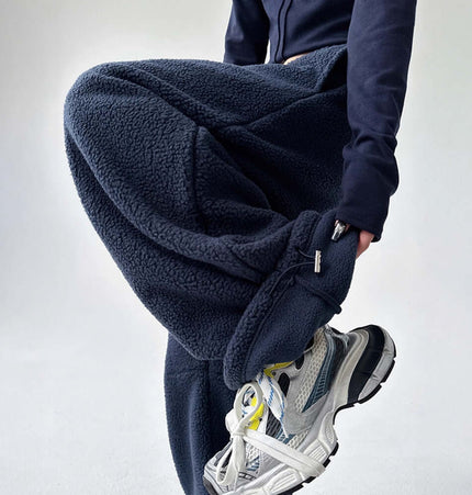 Sherpa Fleece Straight Pants - Loose Fit model wearing navy fleece pants with sneakers