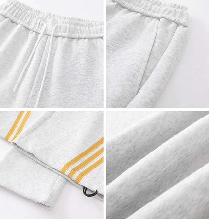 Heavyweight Three-Stripe Pants - Loose Fit details including elastic waistband and three-stripe design.