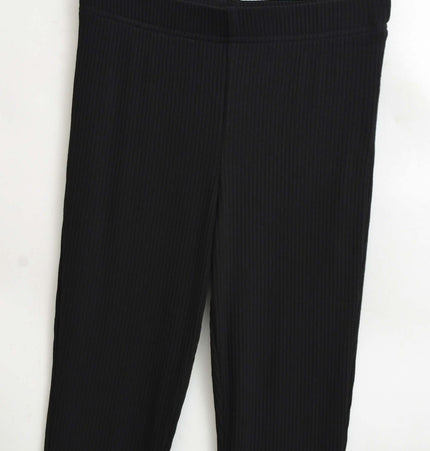 Slim Fit Low Waist Slightly Flared Pants in black with a ribbed texture, perfect for stylish outfits.