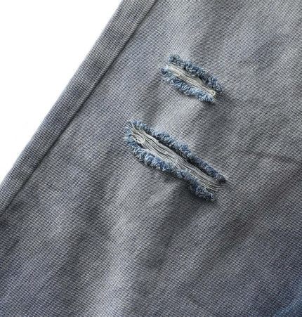 Washed Distressed Denim Pants showcasing detailed rips for a vintage street-style look.