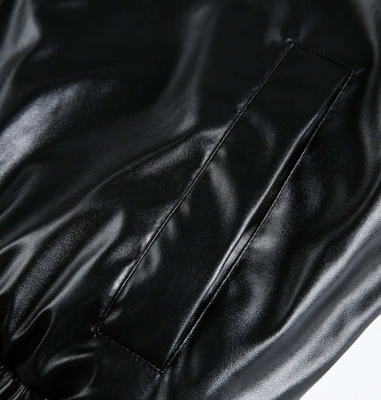 Close-up of the faux leather sleeve of the Oversized Reversible Hooded Parka, highlighting its stylish texture and design.