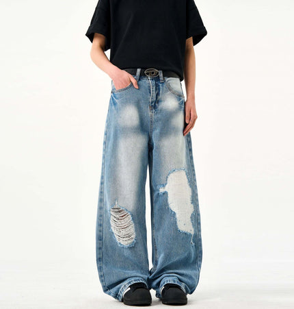 Casual Ripped Light Blue Jeans – Loose Fit worn by a person, showcasing the vintage ripped detailing and loose fit.