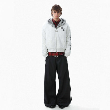 Velvet Hooded Jacket - Loose Fit worn by a model, showcasing casual style with urban flair and oversized pants.