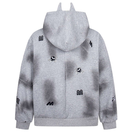Distressed Letter Zip Hoodie - Loose Fit in grey with embroidered designs and playful details on the back.