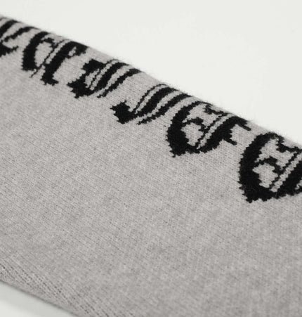 Letter Jacquard Knit Hoodie – Loose Fit close-up showing the bold letter jacquard pattern in gray and black.