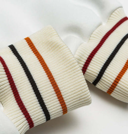 Color-Block Baseball Jacket – Loose Fit cuffs featuring vibrant striped details for a stylish touch.