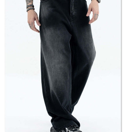 A model wearing Straight Loose Fit Denim Jeans in black with a relaxed fit, showcasing streetwear style and comfort.