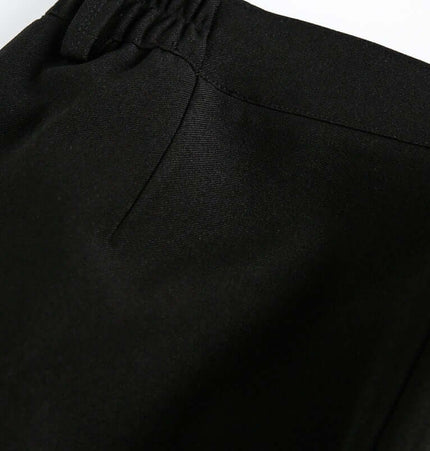 Close-up view of the waistband of Wide Leg Pleated Plaid Trousers showcasing the elastic drawstring detail.