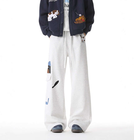 Embroidered Dog Sweatpants – Loose Fit displayed on a model combining playful dog embroidery with relaxed streetwear style.