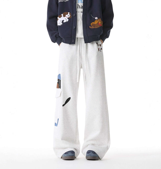 Embroidered Dog Sweatpants – Loose Fit displayed on a model combining playful dog embroidery with relaxed streetwear style.