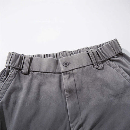 Close-up of the waistband of the Patchwork Distressed Knife Pants showcasing its tailored design and elastic features.