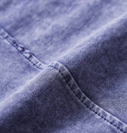 Close-up of the fabric texture of the Retro Tie-Dye Spliced TShirt – Loose Fit showcasing its soft cotton and unique color.