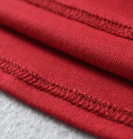 Close-up of the fabric detailing on the Grozavu SculptFit High-Neck Long Sleeve Top in a rich red color.
