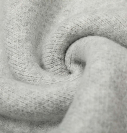 Close-up of soft gray fabric showcasing texture for Semi-High Neck Simple Knit Sweater.
