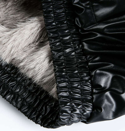 Detail of black faux leather and fur lining of the Oversized Reversible Hooded Parka.