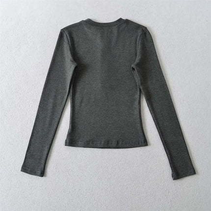 Top de manga larga con media botonera elástica