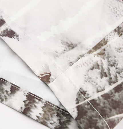 Close-up view of the fabric detailing on the Oil Painting Print Shirt - Loose Fit with artistic print.