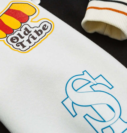 Color-Block Baseball Jacket – Loose Fit with playful prints and vibrant colors, showcasing a modern streetwear style.