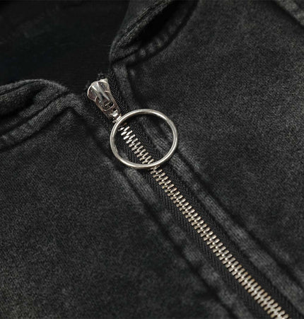 Close-up of the zipper on the Retro Washed Zip Up Hoodie – Loose Fit, showcasing its black distressed fabric and design.