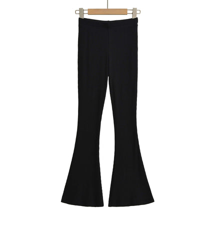 Slim Fit Low Waist Slightly Flared Pants in black, showcasing the leg-lengthening silhouette and flare hem.