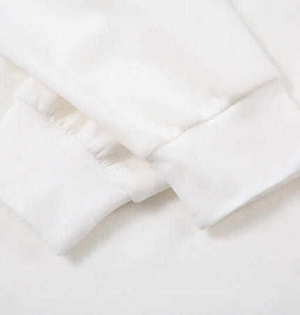 Detail of cuffs on the Retro Embroidered Patchwork Polo Hoodie, showcasing the fabric and construction.