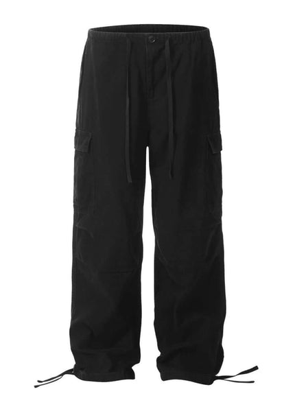 Model wearing Black paratrooper work pants multiple pockets by Grozavu