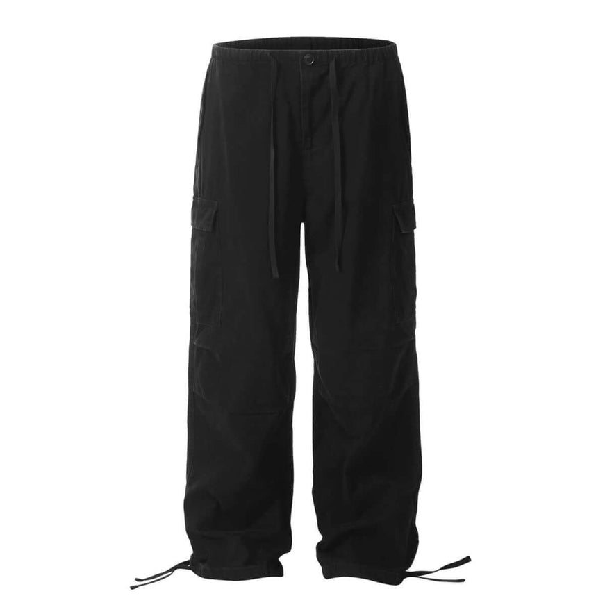 Model wearing Black paratrooper work pants multiple pockets by Grozavu