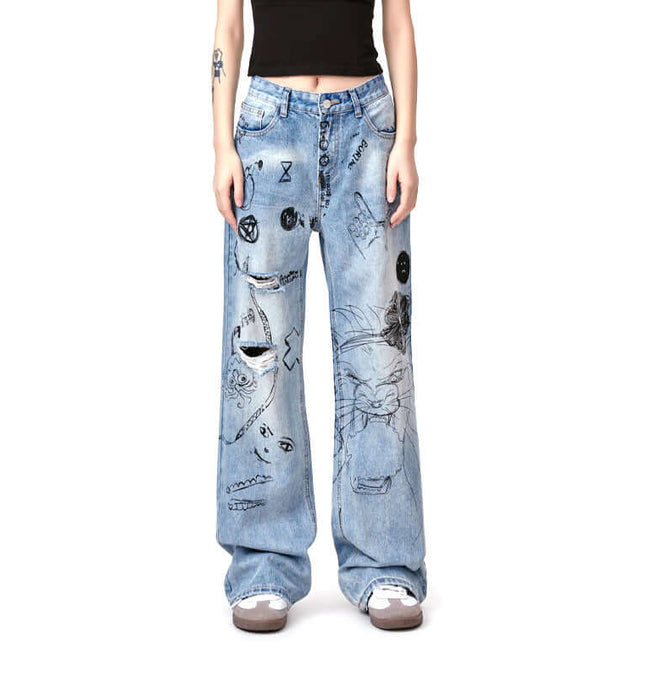 Distressed Denim Graffiti Print Trousers featuring bold graffiti designs and a relaxed fit.