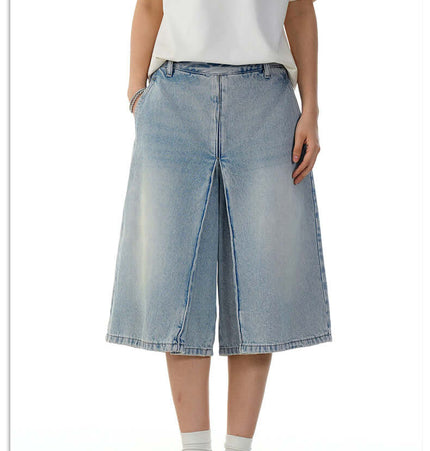 Washed Blue Denim Shorts – Loose Fit worn by model, showcasing relaxed fit and vintage style.