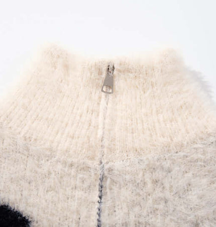 Close-up of the collar and zip detail of a Floral Jacquard Knit Cardigan – Loose Fit, highlighting its cozy texture.