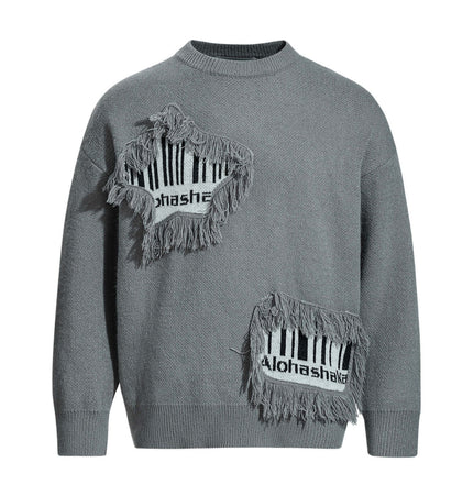 Fringe Patchwork Knit Sweater – Loose Fit featuring raw-edge patchwork and fringe accents in gray.