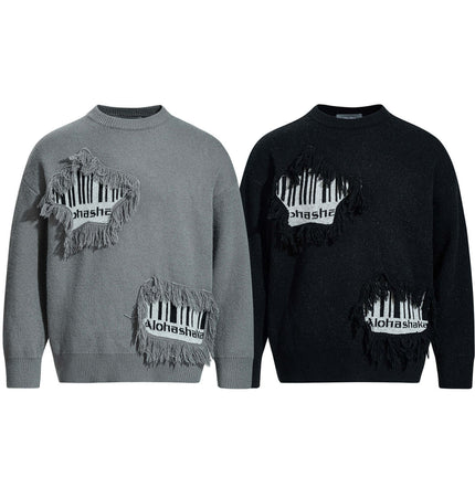 Fringe Patchwork Knit Sweater – Loose Fit in gray and black with fringe detailing and graphic accents.