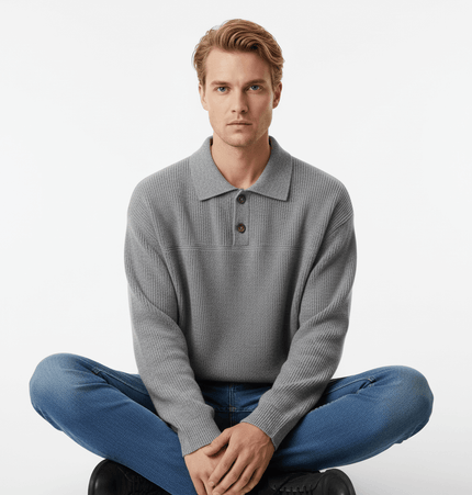 Casual Ribbed Half-Zip Sweater worn by a man in grey, sitting cross-legged in a modern casual pose.