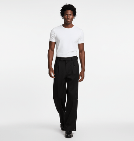 Stylish man wearing Wide Leg Pleated Plaid Trousers with a white t-shirt, showcasing casual streetwear appeal.