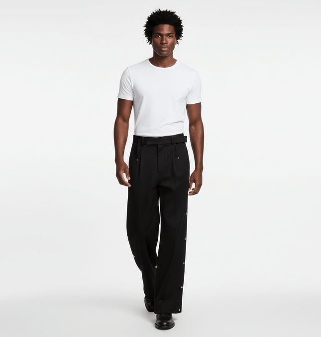 Stylish man wearing Wide Leg Pleated Plaid Trousers with a white t-shirt, showcasing casual streetwear appeal.