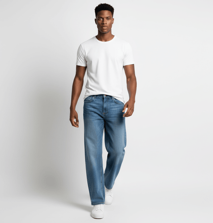 Model wearing Washed Micro Flared Jeans – Loose Fit with a white t-shirt, showcasing a casual streetwear style.