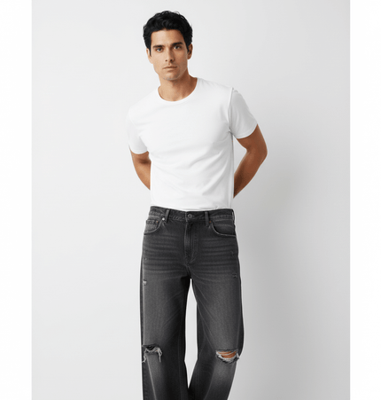Washed Distressed Denim Pants showcased on a model wearing a white t-shirt, perfect for casual street style.