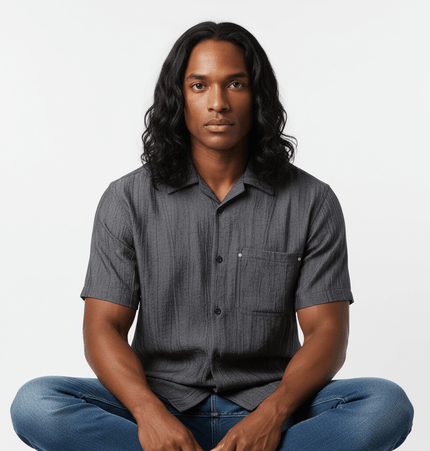 Polo Collar Short Sleeve Shirt – Loose Fit model wearing a stylish black shirt, showcasing a relaxed fit and functional pocket.