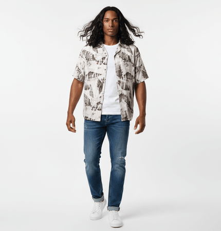 Oil Painting Print Shirt - Loose Fit modeled by a man walking in casual attire with jeans and a relaxed shirt.