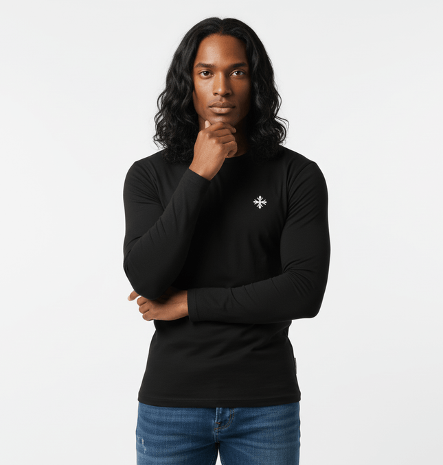 Long Sleeve Printed TShirt - Slim Fit displayed by a model with long hair in a minimalist studio setting.