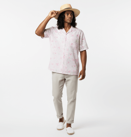 Butterfly Jacquard Printed Shirt worn by a model, featuring a pink butterfly pattern and relaxed fit for summer style.