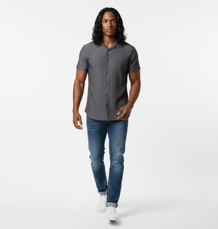 Polo Collar Short Sleeve Shirt – Loose Fit modeled by a man walking, featuring a stylish gray color and relaxed fit.