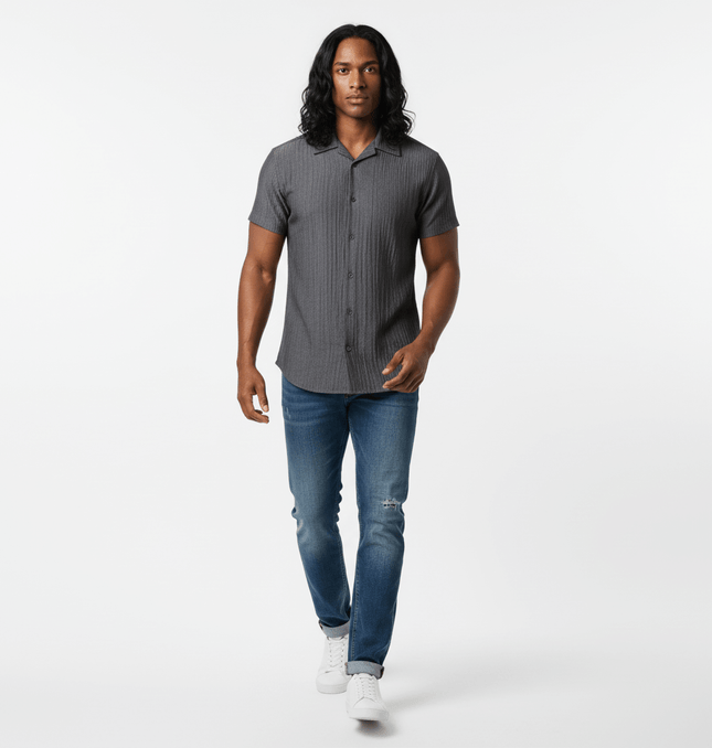 Polo Collar Short Sleeve Shirt – Loose Fit modeled by a man walking, featuring a stylish gray color and relaxed fit.
