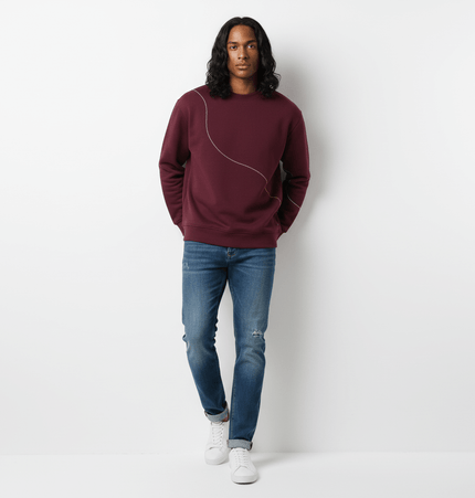 Round Neck Letter Print Hoodie – Loose Fit model wearing a maroon pullover with jeans, showcasing casual streetwear style.