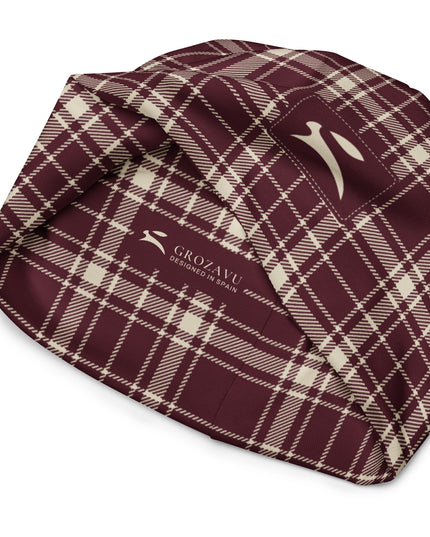 Heritage Tartan Beanie in bordeaux and bone tartan, turned inside out to show the printed Grozavu label
