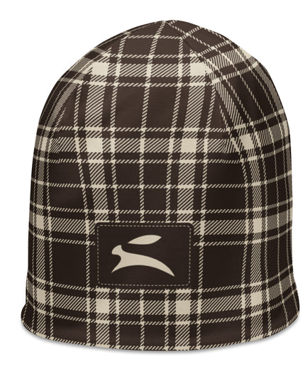 Heritage Tartan Beanie in cocoa brown and bone tartan, three-quarter view from the left with the hare patch