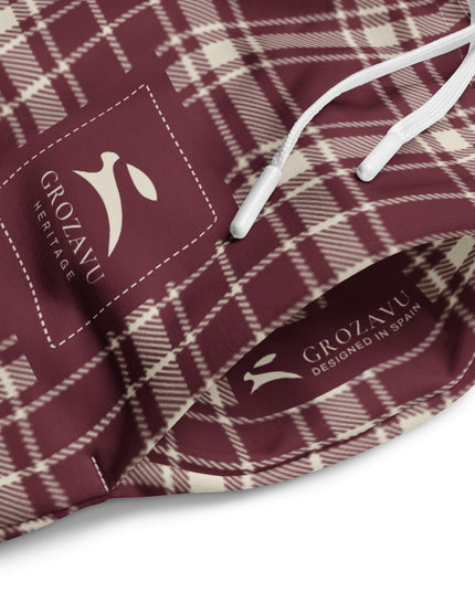 Heritage Tartan Wide-Leg Joggers in bordeaux and bone tartan, close-up of the drawstring waist with the printed Grozavu labels inside and out