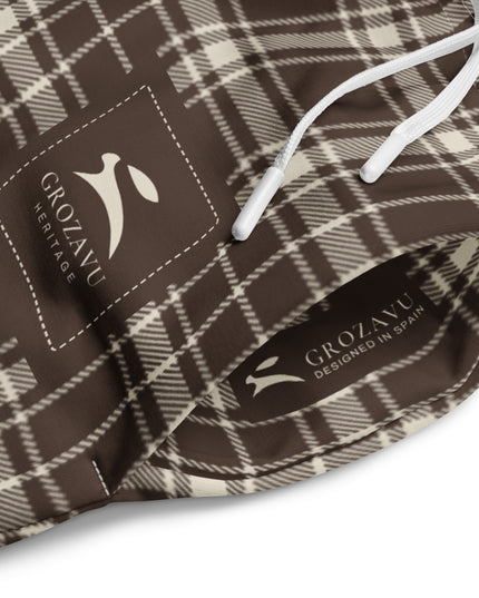 Heritage Tartan Wide-Leg Joggers in cocoa brown and bone tartan, close-up of the drawstring waist with the printed Grozavu labels inside and out