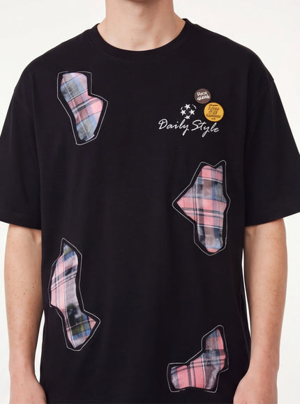 Back view of Black applique badge graphic tee by Grozavu
